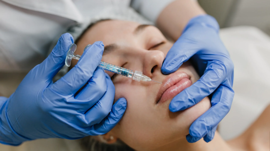 closeup-portrait-young-woman-doing-botox-procedures-by-professional-injection-making-lips-modern-devices-technology-medicine-cosmetology-therapy