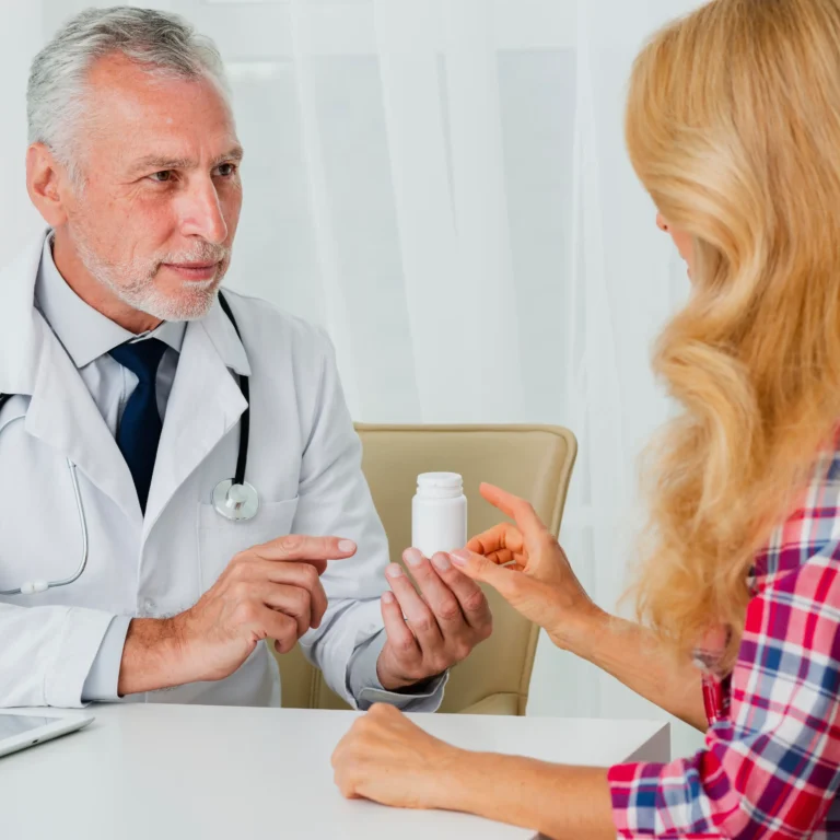 doctor-handing-medication-patient