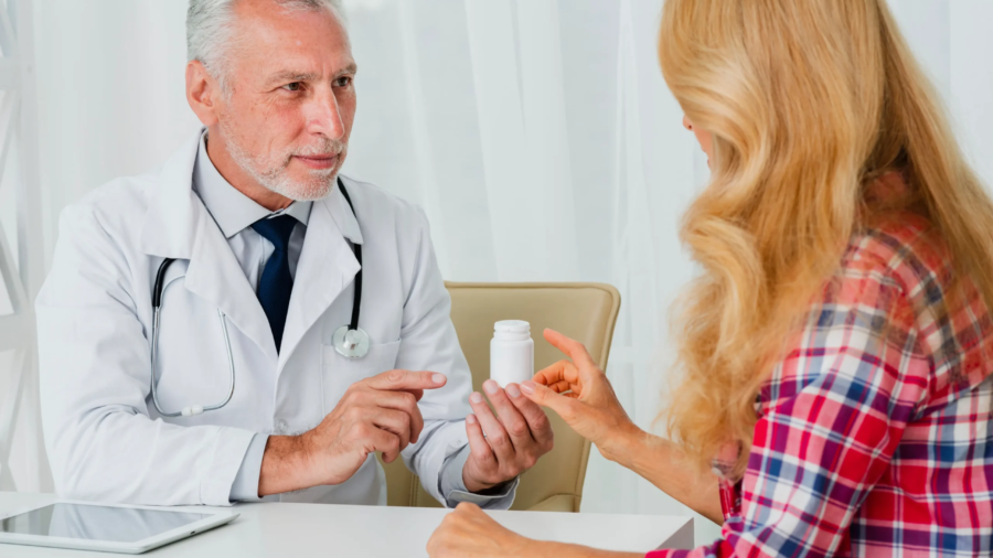 doctor-handing-medication-patient