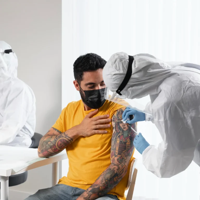 doctor-vaccinating-patient-center