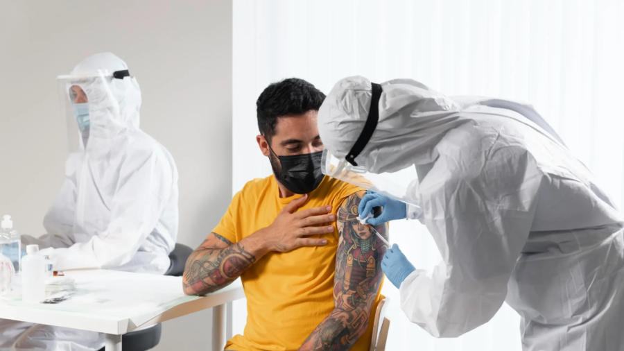 doctor-vaccinating-patient-center