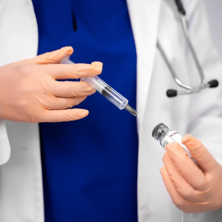 front-view-doctor-holding-injection