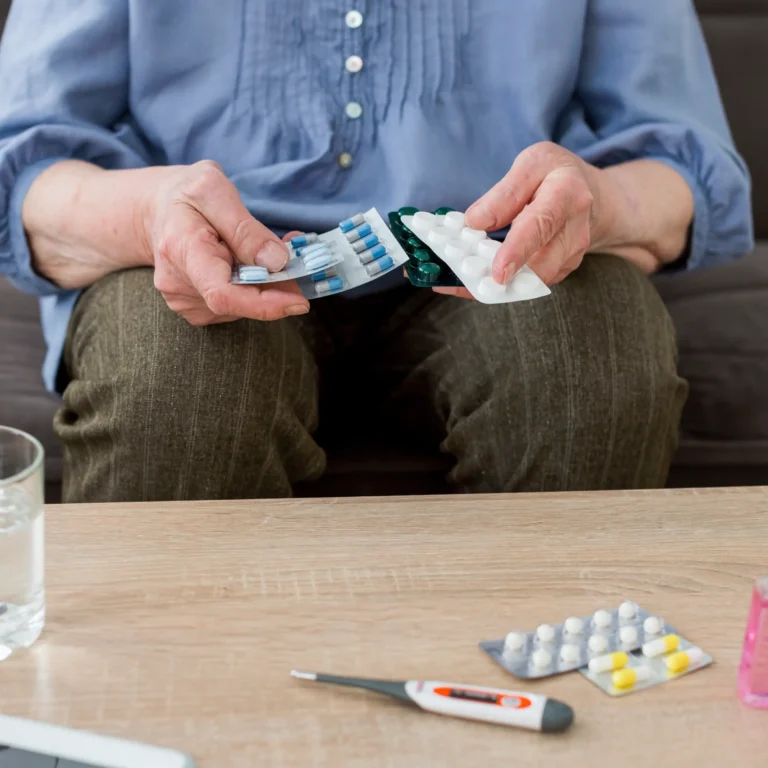 front-view-elder-woman-taking-her-pills