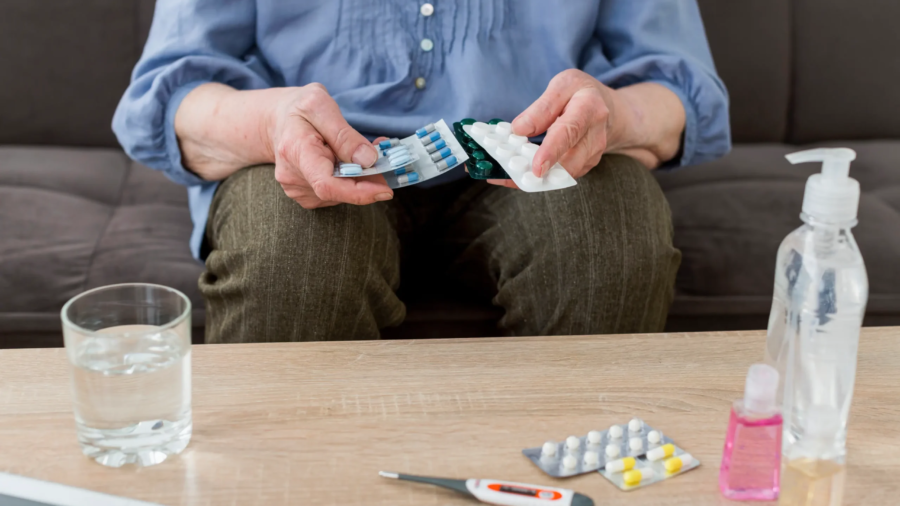 front-view-elder-woman-taking-her-pills