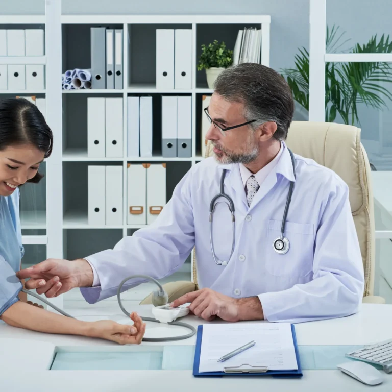 medium-shot-doctor-checking-blood-pressure-female-patient