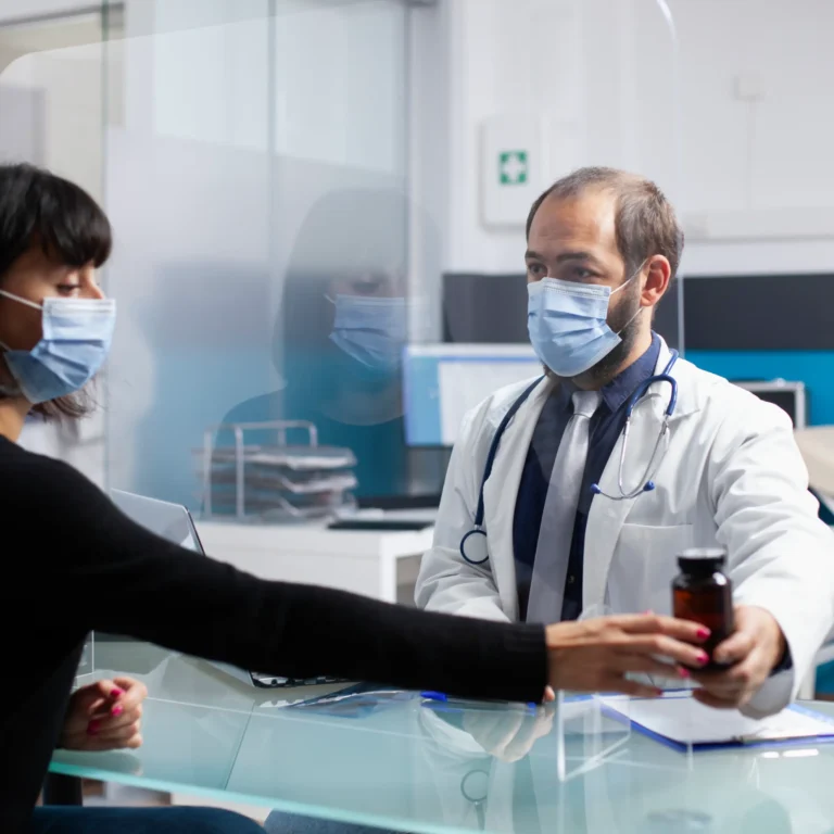 physician-gives-pills-bottle-woman