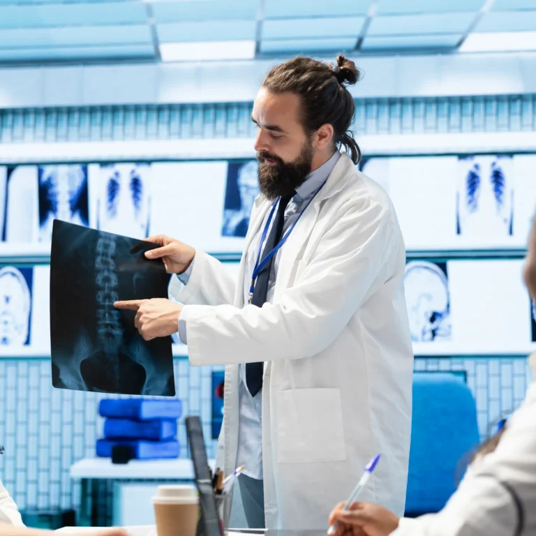 physician-his-medical-team-meet-office-analyze-radiography-data