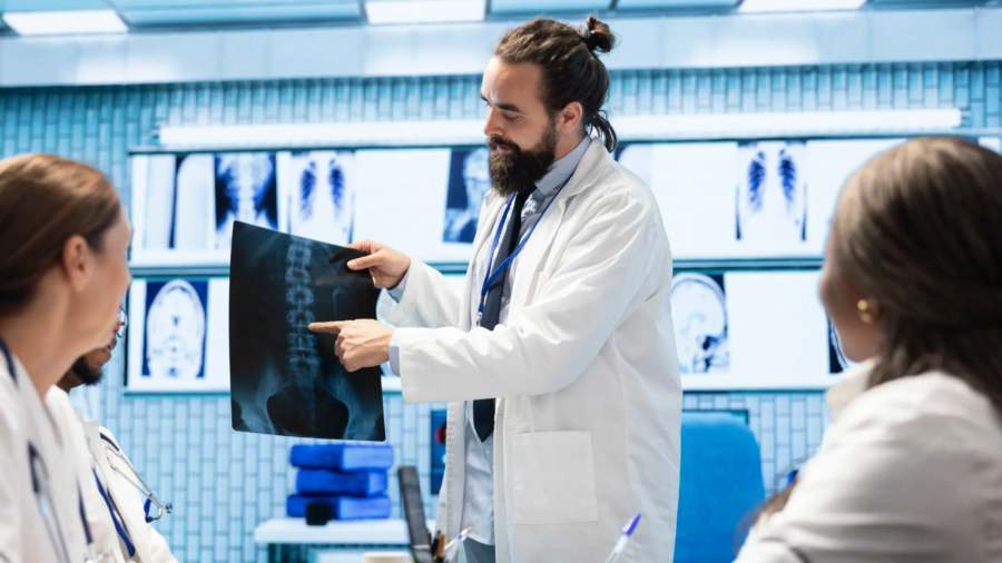 physician-his-medical-team-meet-office-analyze-radiography-data