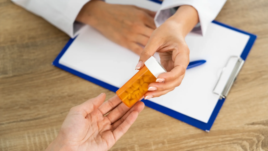 high-angle-people-holding-pills