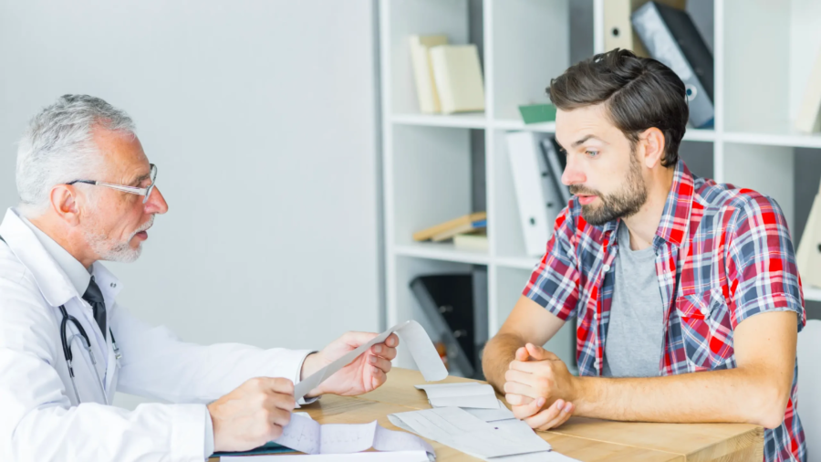 senior-doctor-talking-with-patient-office